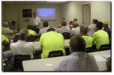 Picture of safety group meeting in a room to go over policy